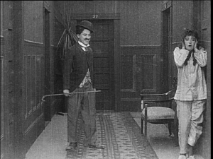 In Mabel's Strange Predicament, Dublin audiences saw Chaplin's tramp costume for the first time in a film whose comedy comes largely after Mabel locks herself out of her hotel room in her pajamas.