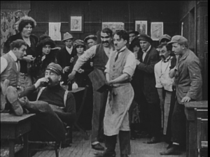 Chaplin prepares to deal with a difficult customer in Caught in a Cabaret.